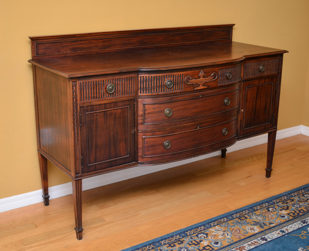 Appraisal: CARVED MAHOGANY SIDEBOARD Backsplash over bowed center section with drawers