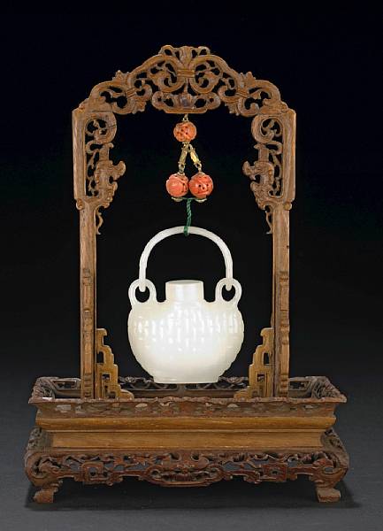 Appraisal: A small white jade hanging vase and cover The flattened