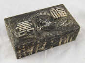 Appraisal: A Chinese silver plated cigarette box with embossed bamboo and