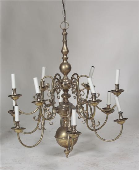 Appraisal: A Dutch style brass chandelier with two graduated scrolling branchs