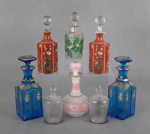 Appraisal: Eight glass scent bottles with enamel paint and gilt decoration