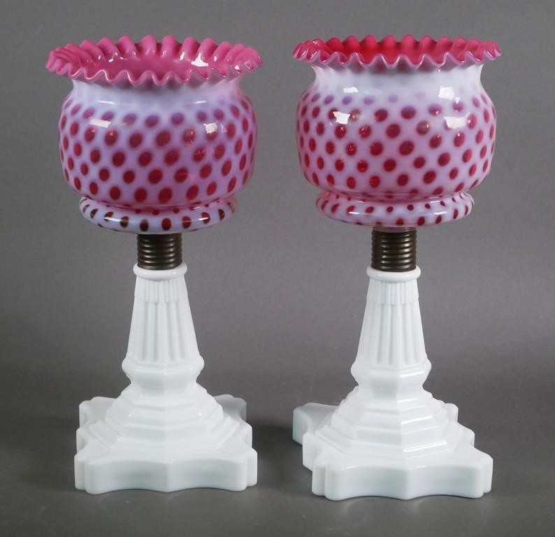 Appraisal: VINTAGE CRANBERRY COINSPOT GLASS CANDLESTICKSPair of large candlesticks with white