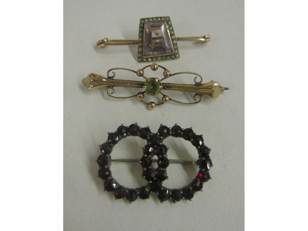 Appraisal: Lot comprising garnet brooch with foil back and two Edwardian