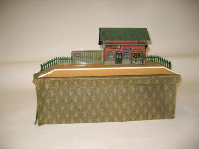 Appraisal: A small tin printed British style station and platform by