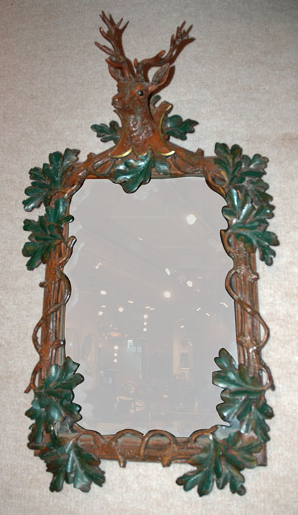 Appraisal: Bavarian Style Animal Trophy and Leaf Decorated Composition Mirror Estimate