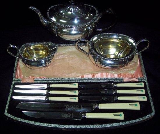 Appraisal: A three-piece plated teaset with beaded rims comprising teapot cream