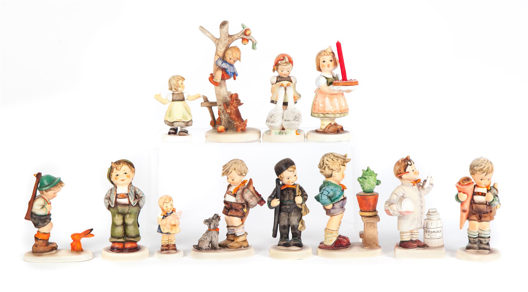 Appraisal: TWELVE HUMMEL FIGURINES Germany th and st centuries Group includes