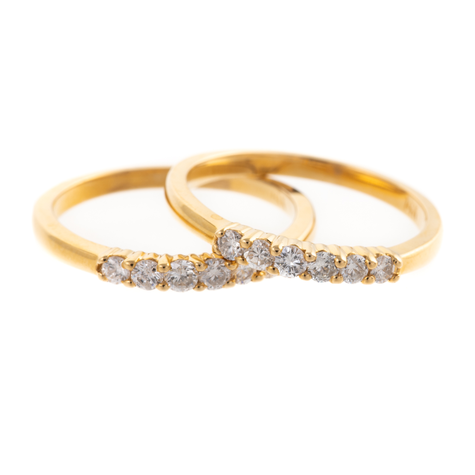 Appraisal: A MATCHED PAIR OF K DIAMOND BANDS Two K yellow