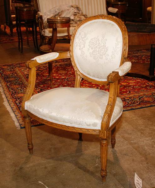 Appraisal: A pair of Louis XVI style beechwood fauteuils th century