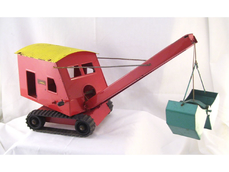 Appraisal: Structo Toy Shovel Original red green and yellow paint Measures