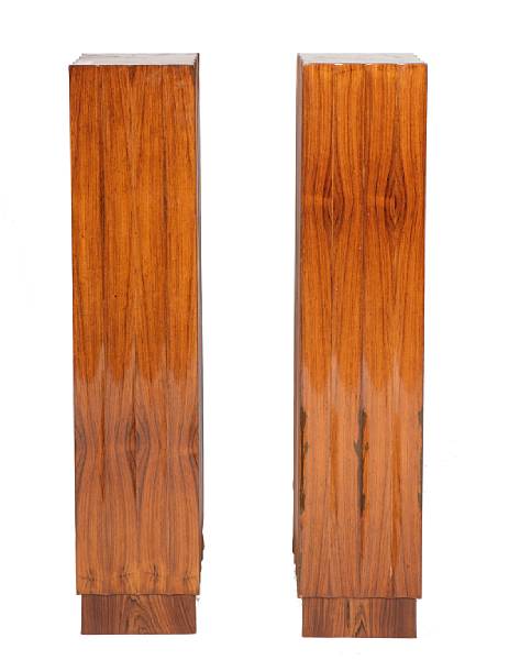 Appraisal: A pair of Art Deco style rosewood veneered fluted pedestals