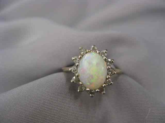 Appraisal: Opal DIamond Ring fiery gem surroundedby diamonds in k yellow