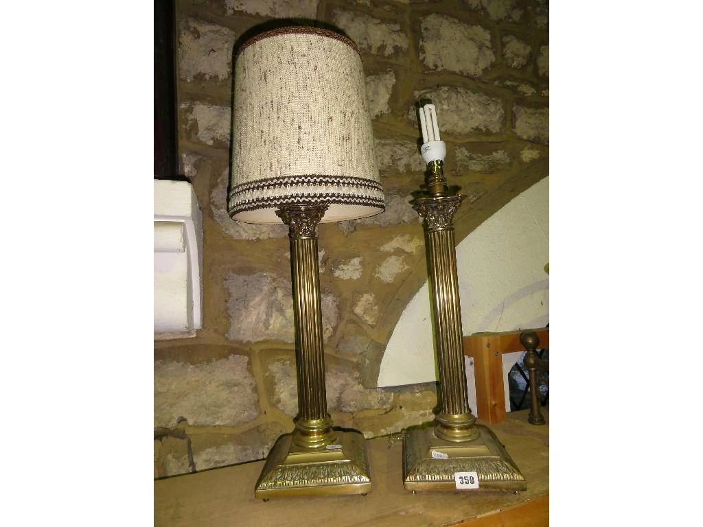 Appraisal: A pair of Corinthian style brass table lamps with scrolled