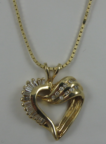 Appraisal: DIAMOND AND FOURTEEN KARAT GOLD PENDANT NECKLACE the heart pendant