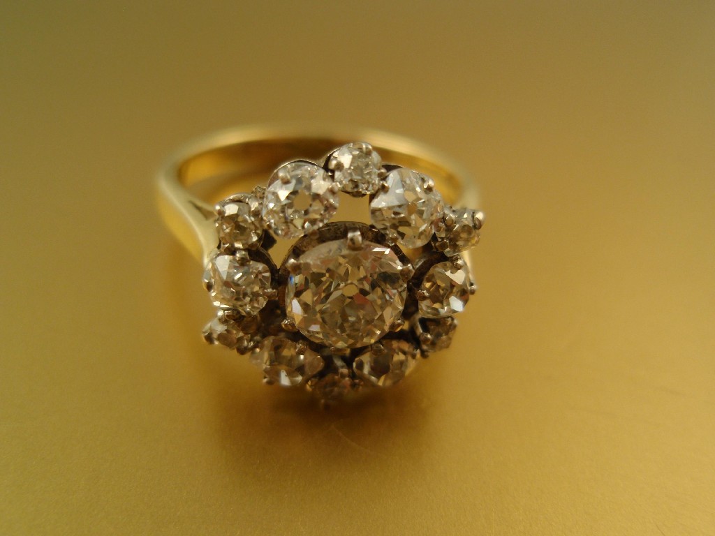 Appraisal: A diamond cluster ring of old cushion and eight cut