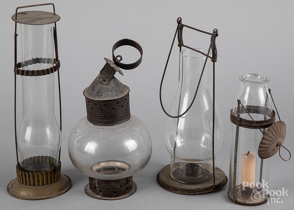 Appraisal: Four tin and glass carry lanterns th c Four tin