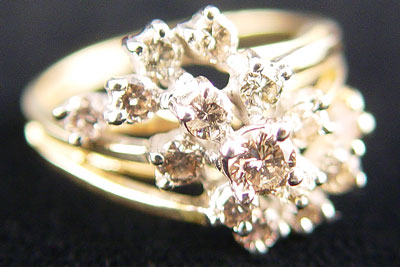 Appraisal: GOLD AND DIAMOND COCKTAIL RING K yellow gold cluster ring