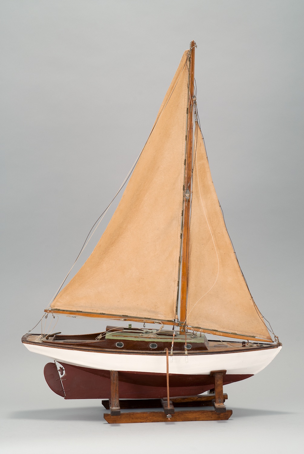 Appraisal: WOODEN SAILBOAT MODEL Circa A Marconi-rigged sloop Hull painted white