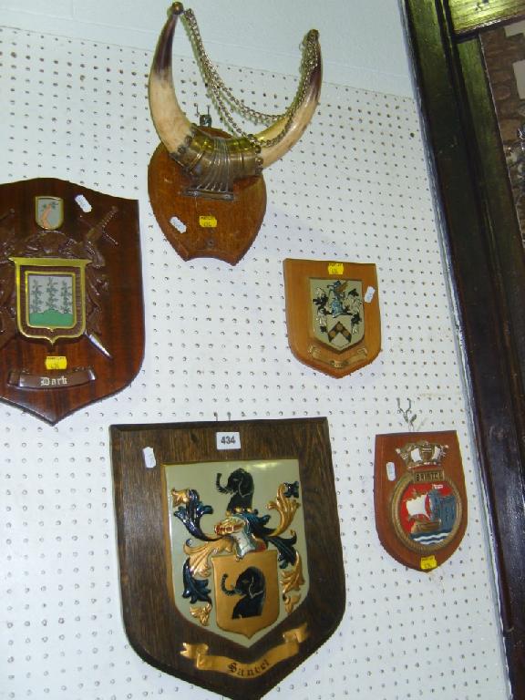 Appraisal: A collection of wooden plaques with relief moulded and painted