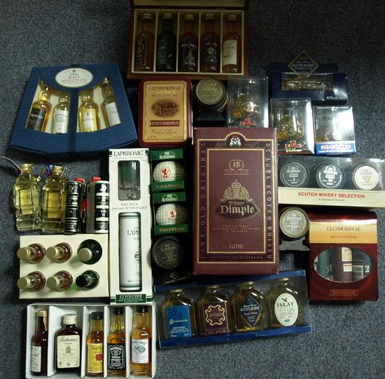 Appraisal: A collection of miniature whisky bottles and a litre bottle