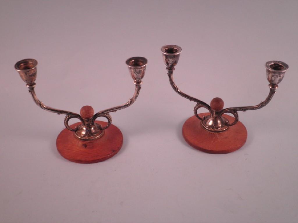 Appraisal: A pair of Danish silver two branch candelabra each with