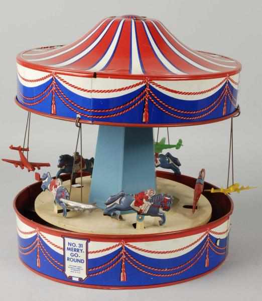 Appraisal: Tin Litho Wolverine Merry Go Round Toy Description American Lever