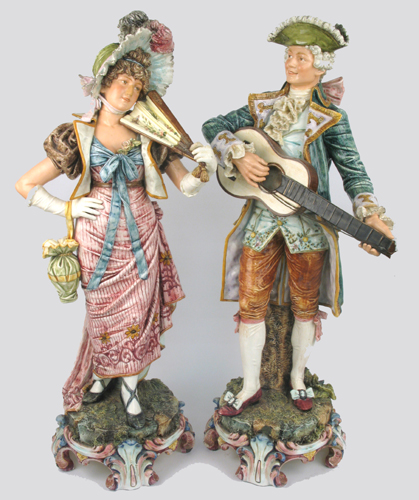 Appraisal: PAIR BRITISH VICTORIAN GLAZED POTTERY FIGURES The man in th