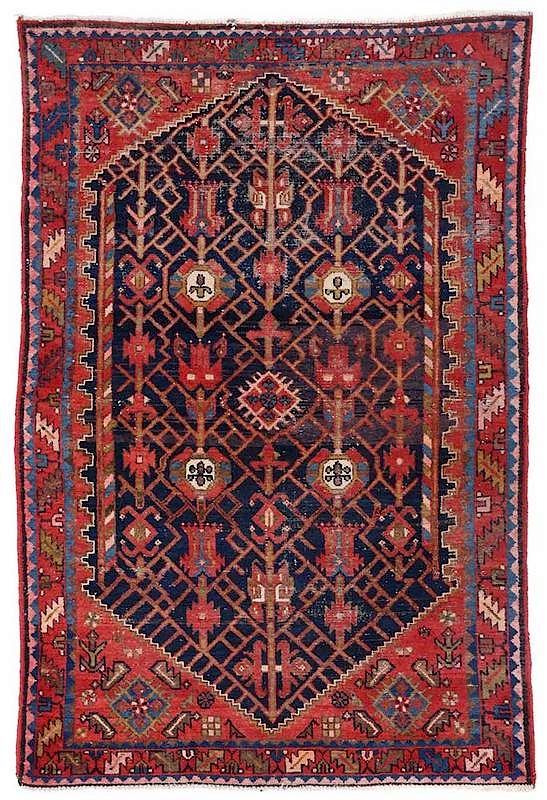 Appraisal: Persian Rug navy blue field with lattice design stepped spandrels