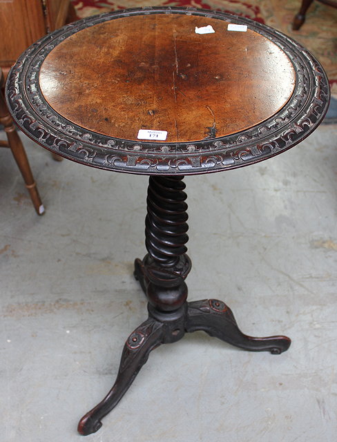 Appraisal: A VICTORIAN WALNUT EBONISED OCCASIONAL TABLE the circular top with