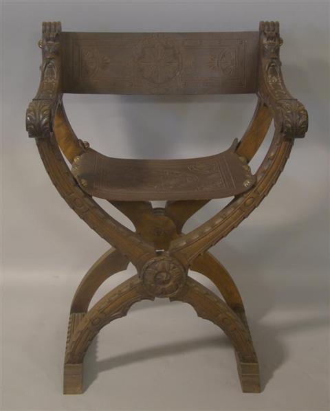 Appraisal: RENAISSANCE REVIVAL X FRAME CARVED AND LEATHER ARMCHAIR Savarnola style