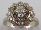 Appraisal: A French hallmarked carat white gold diamond cluster ring the