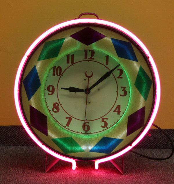 Appraisal: Machine Age neon circular clock painted face reverse painted diamond