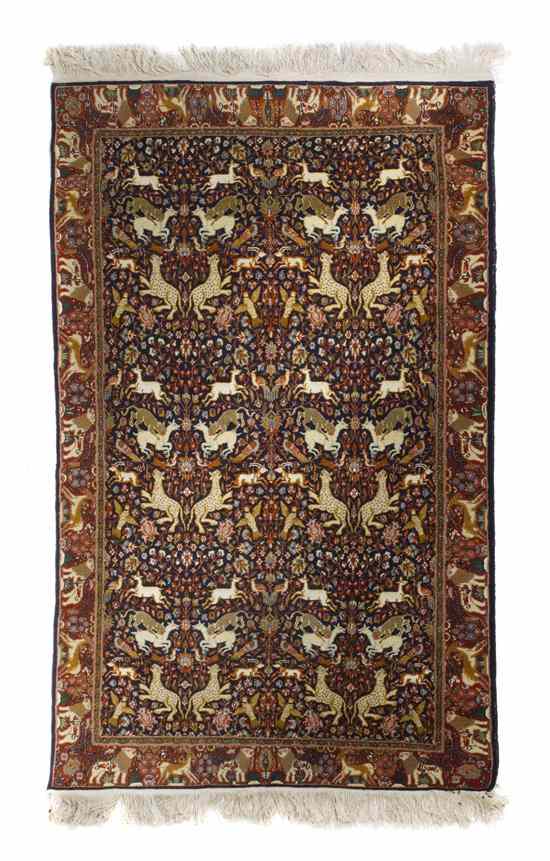 Appraisal: A Persian Wool Pictorial Carpet having allover decoration depicting animals