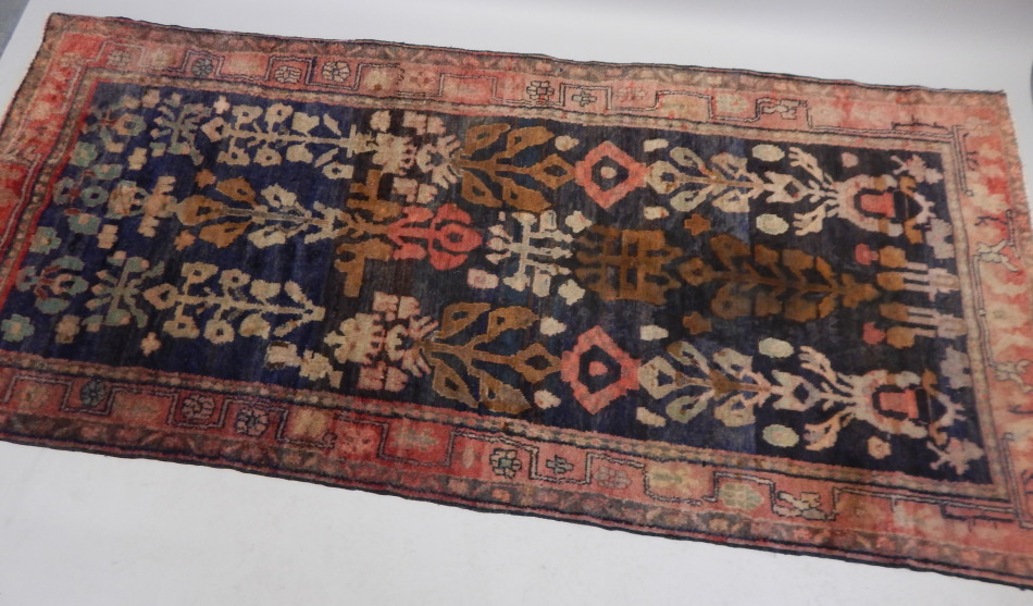 Appraisal: A Hamedan rug with a design in ink and red