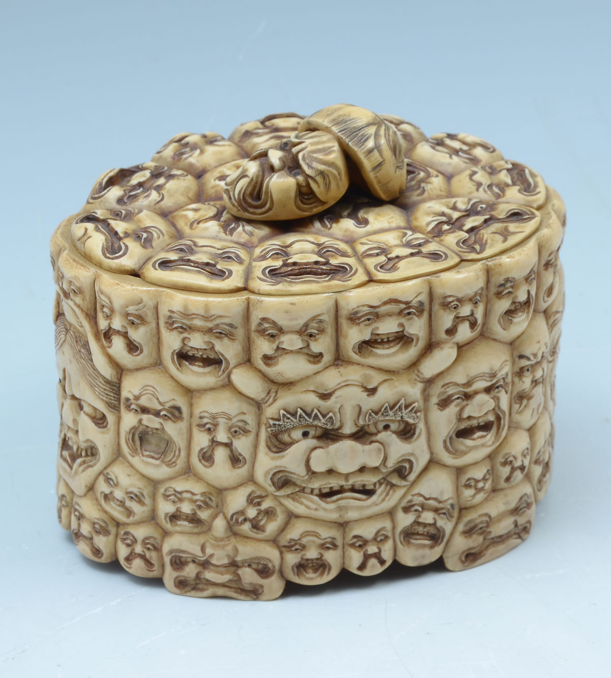 Appraisal: JAPANESE CARVED THOUSAND FACES MEIJI IVORY BOX Incredibly carved th