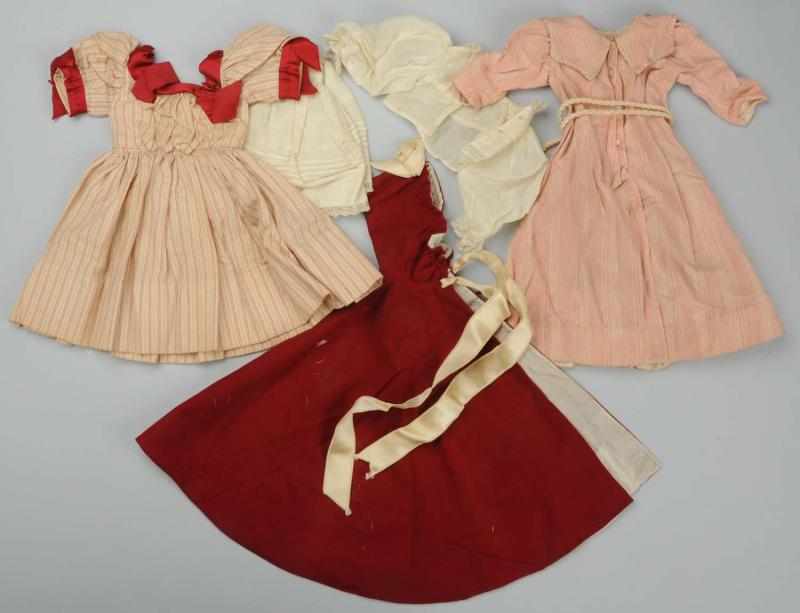 Appraisal: Antique Doll Clothes Lovely cream and red striped wool dress