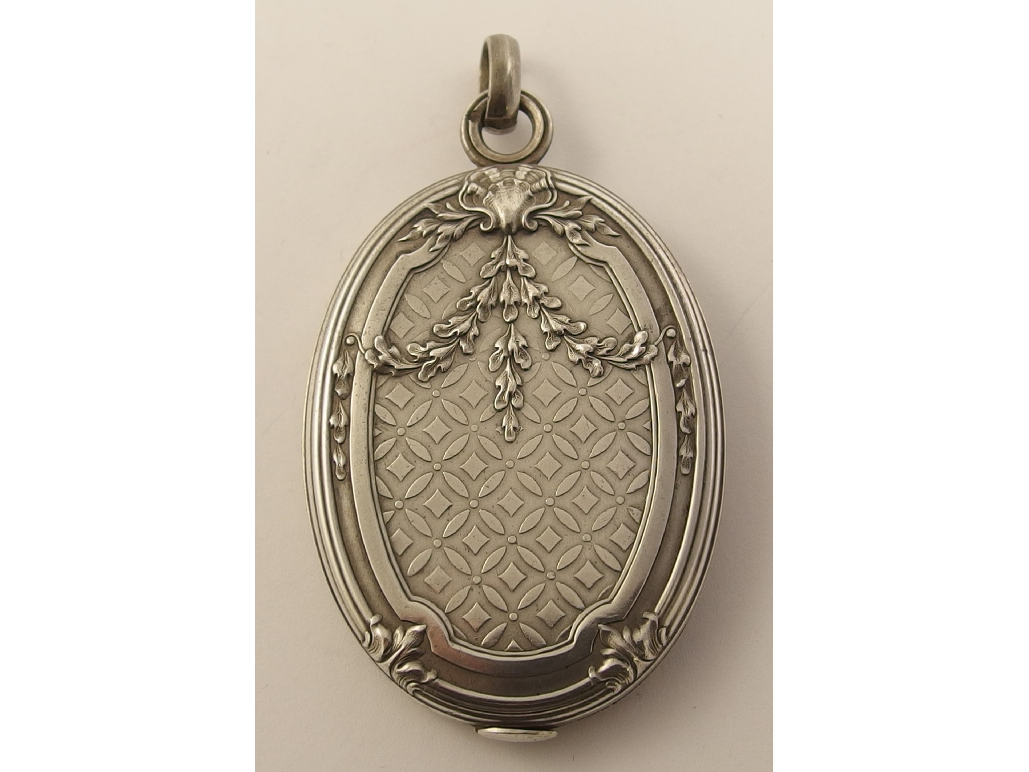 Appraisal: An unusual French silver double mirror locket the case slides