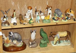 Appraisal: Two shelves of associated animal figurines executed in porcelain including