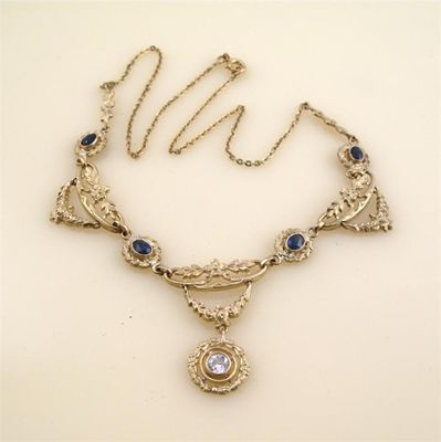 Appraisal: A gold necklace set with diamond and quartz blue stones