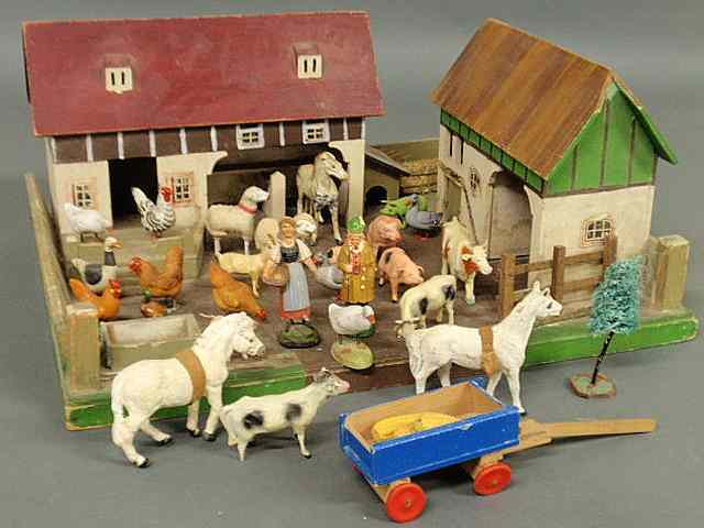 Appraisal: Toy barnyard with painted wood buildings barnyard and an assembled