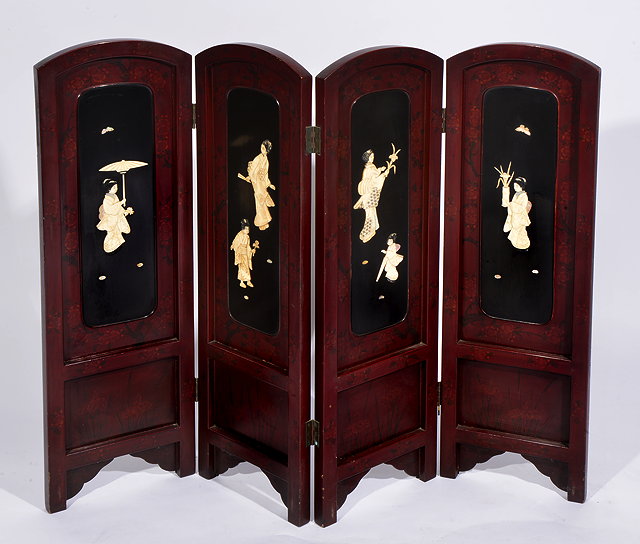 Appraisal: A SMALL ORIENTAL THREE FOLD RED LACQUERED SCREEN the panels