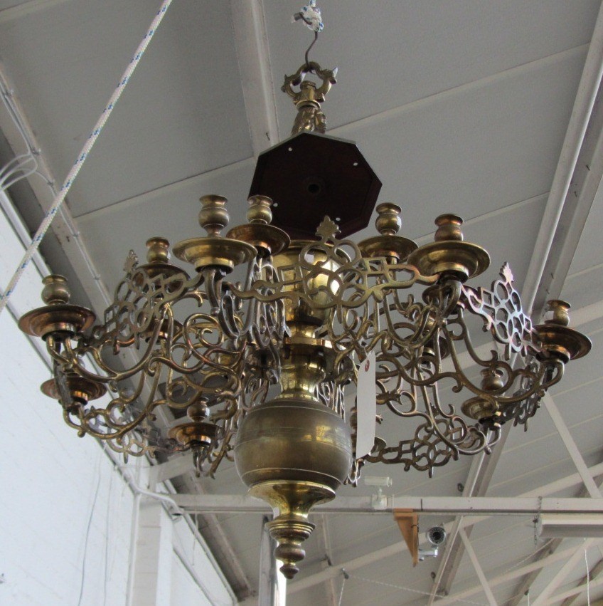 Appraisal: A Flemish brass sixteen light chandelier the figural stem issuing