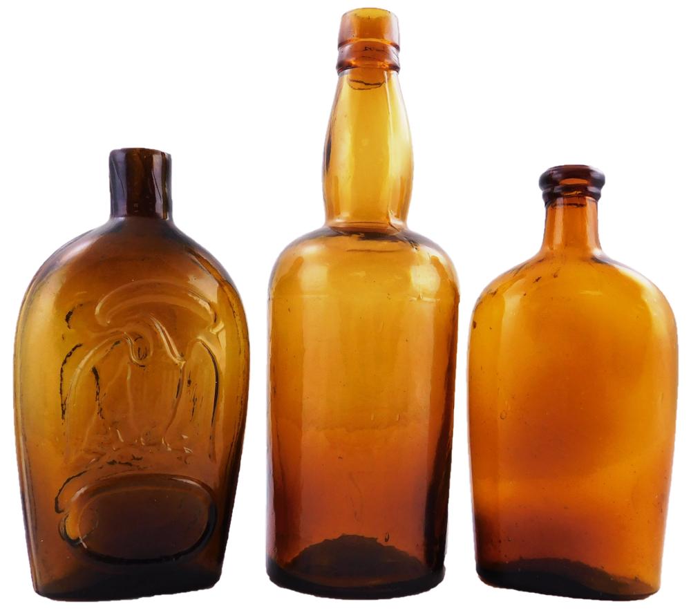 Appraisal: GLASS Three amber-colored glass bottles including Stoddard Glass Works open