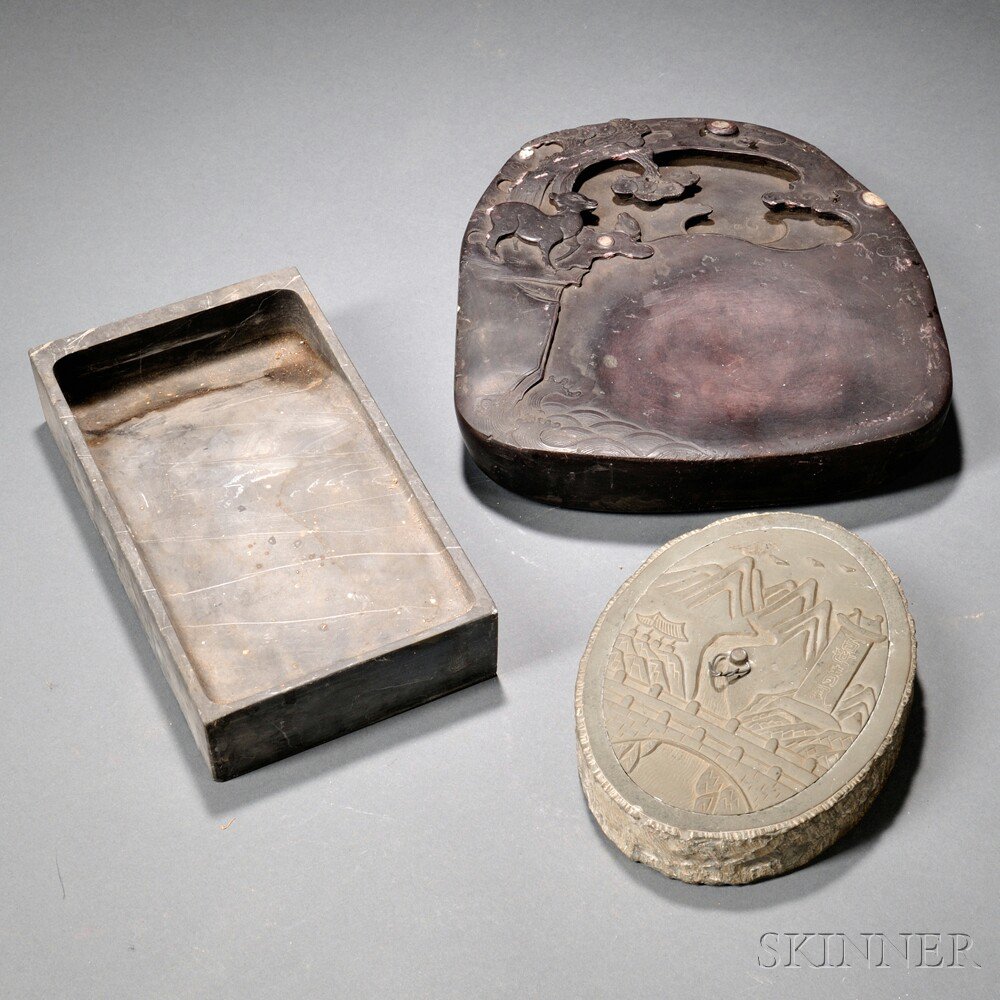 Appraisal: Three Inkstones China an oviform limestone with a carved landscape