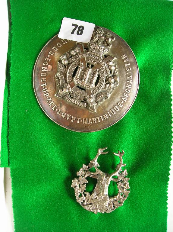 Appraisal: A silver-plated Gordon Highlanders badge together with a silver-plated Kings