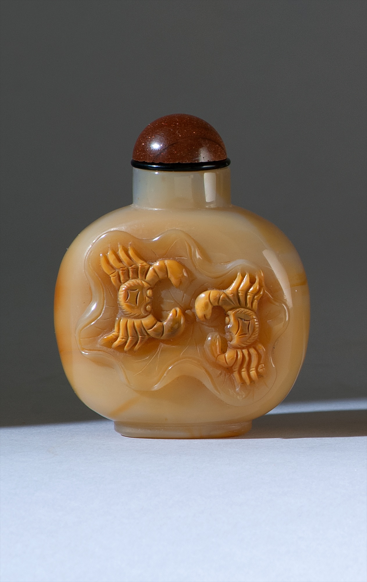 Appraisal: CAMEO AGATE SNUFF BOTTLE th CenturyIn ovoid form with crab