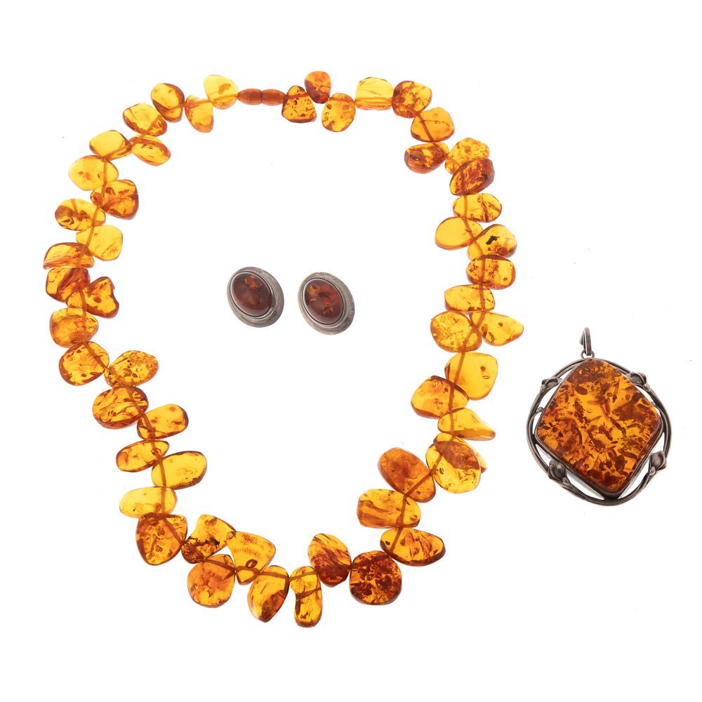 Appraisal: A Suite of Amber Jewelry in Sterling Necklace featuring freeform