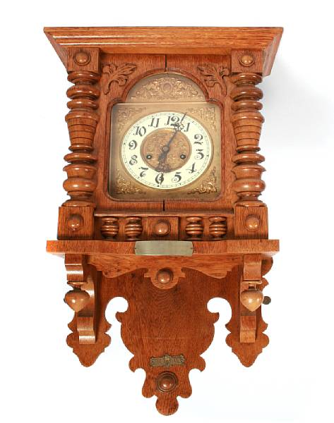 Appraisal: A French oak regulator clock height in