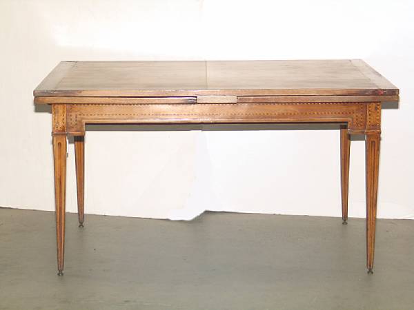 Appraisal: An Italian Neoclassical inlaid walnut draw leaf dining table partially