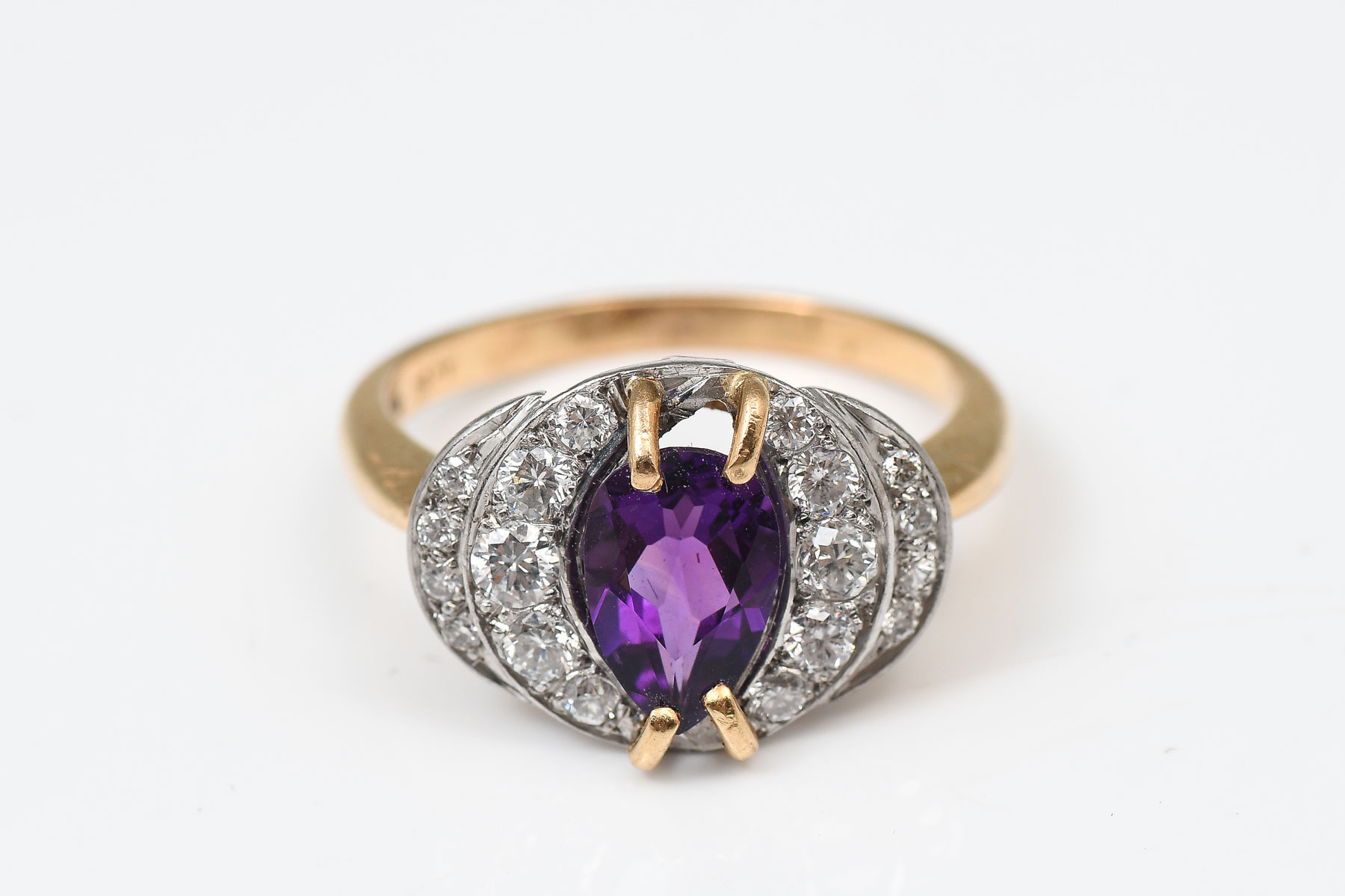 Appraisal: K AMETHYST AND DIAMOND RING K yellow gold ring contains